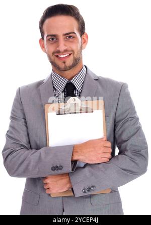 Young business man holding a blank paper on a clip board over white background Stock Photo