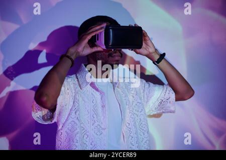 Engaging with Virtual Reality Headset Experience Stock Photo