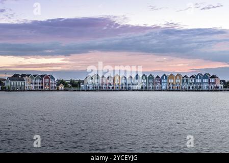 Houten, Netherlands, August 4, 2016: Calm evening at the famous Rainbow houses in the Netherlands. Colored wooden houses Stock Photo