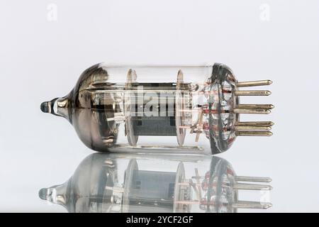 Close-up photo of old soviet radio tube isolated on white background with reflection. Stock Photo