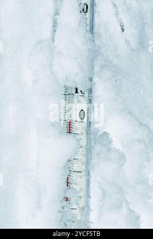 Thermometer in snow zero degrees Stock Photo