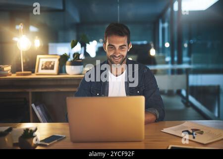 Office, laptop and business man at night for website, research and online for project. Professional, company and person on computer for working late Stock Photo