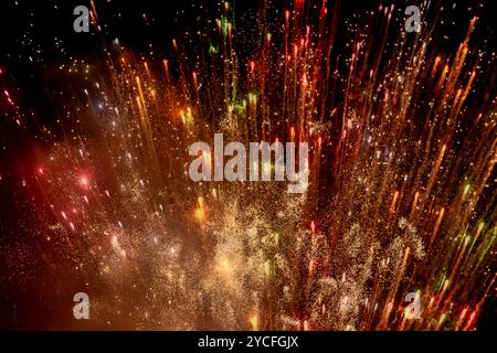 Fireworks exploding in the night sky Stock Photo