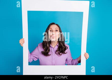 Full size photo of attractive young woman sit floor relax hands behind head dressed nightwear wake up day light home interior living room Stock Photo