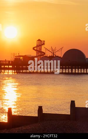 England, Kent, Herne Bay, Sunrise over Sea and Pier in Background Stock Photo