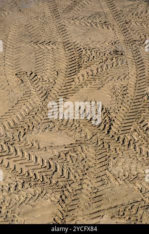 Tyre tire marks in the sand in Newquay in Cornwall in the UK. Stock Photo