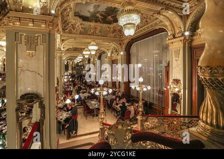 Budapest, Hungary. Oct 23,2024: The famous New York Café, one of legendary places in Hungarian capital & historically graced by all leading lights of art, culture & literature, is known as the World's Most Beautiful Coffee House. Part of New York Palace, built in eclectic Italian Renaissance-style, this popular venue haunted by stories, legends & traditions, celebrates today the 130th anniversary of its opening on 23 October 1894 & the 70th year of its reopening in 1954 after WWII serving a multicultural cuisine inherited from the Austro-Hungarian Monarchy. Credit: Kevin Izorce/Alamy Live News Stock Photo