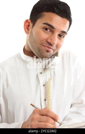 Businessman on phone call with newspaper Stock Photo