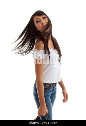 Young carefree woman flicking hair Stock Photo