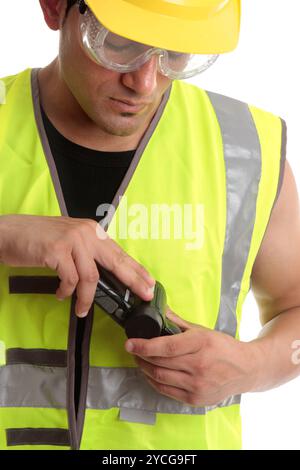 Builder with measuring device Stock Photo