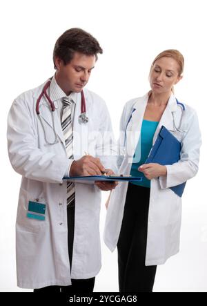 Two doctors discuss a patients medical ailment or treatment. Stock Photo