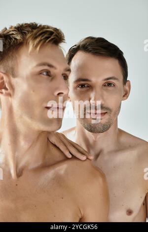 A young gay couple shares a loving embrace in a warm, tender moment
