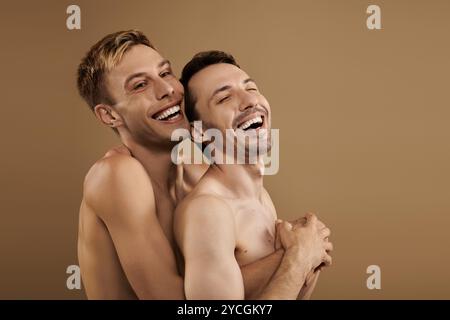 A happy couple shares a tender moment, laughing and showing affection in playful closeness. Stock Photo