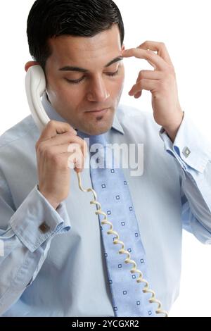 Troubled or depressed businessman making call Stock Photo