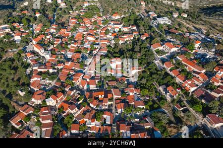 Aerial view of Lofou a charming village in Cyprus showing traditional architecture with red tile roofs on a sunny summer day. Limassol District, Cypru Stock Photo