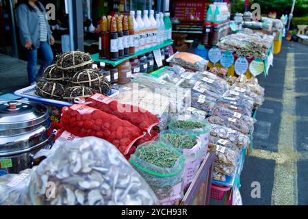 Ulsan, South Korea - October 22nd, 2023: A vibrant market stall near the entrance to Seoknamsa Temple, showcasing various local products like dried he Stock Photo