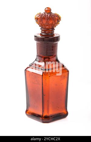 Glass brown retro bottle with stopper crown Stock Photo