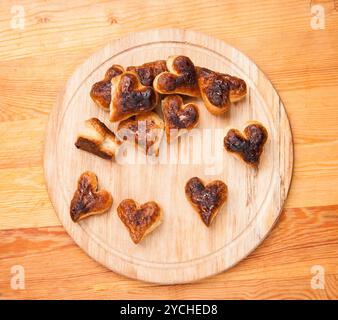 Bakery hearts from split pastry on wooden Stock Photo