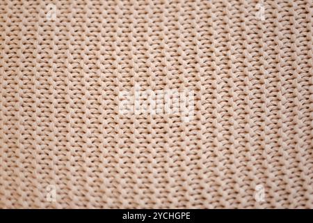 A close up of a knit fabric with a white background. The fabric is made of wool and has a very fine texture Stock Photo