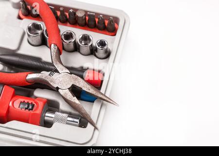 Open toolbox with screwdriver, heads and bit Stock Photo