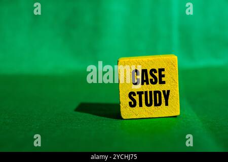 Case study message written on yellow wooden cube with green background. Conceptual case study symbol. Copy space. Stock Photo