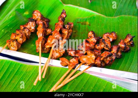 Traditional Thai food at market. Delicious chicken Stock Photo