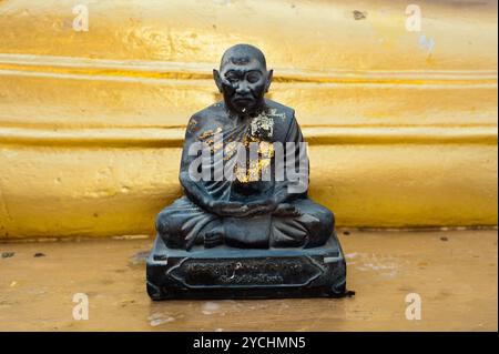 Black monk statue in Wat Phra Yai Temple. Thailand Stock Photo