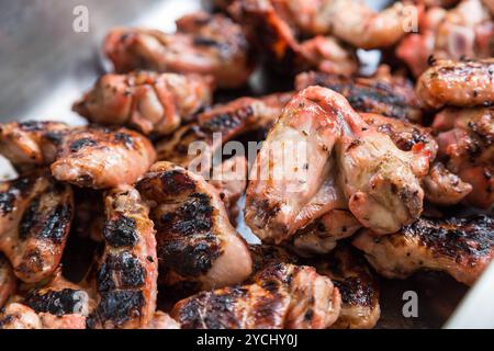 Juice marinated chicken wings on barbecue Stock Photo