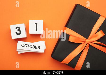 Happy Halloween day with pumpkin and 31 October calendar. Trick or Threat, Hello October, fall autumn, Festive, party and holiday concept. Top view Stock Photo