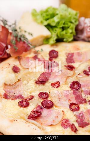 Hot pizza with garnish and components Stock Photo