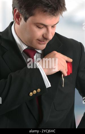 Man businessman holding credit card or other plastic card Stock Photo