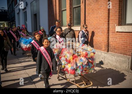 The Emotional Baggage Cart Parade by Theda Sandiford travels across West 14th street in New York on Sunday, October 20 as part of the Art In Odd Places (AIOP) festival. The festival features numerous performance pieces staggered across East and West 14th Street.(© Richard B. Levine) Stock Photo