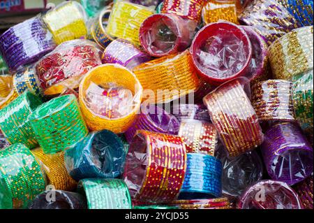 Lot of colorful cheap bangles at Indian market place Stock Photo