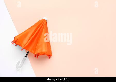 Mini stylish umbrella on colorful background Stock Photo