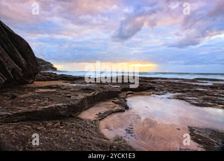 The suns rays break through the clouds Stock Photo