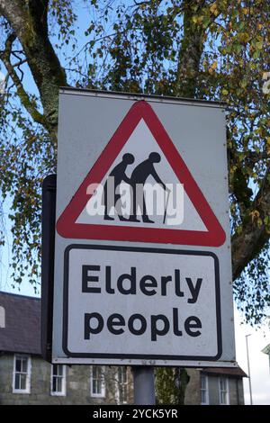 Elderly people crossing road sign. warning sign for motorists in area of elderly pedestrians Stock Photo