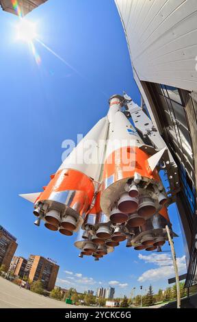 SAMARA, RUSSIA - APRIL 25: Real Soyuz type rocket as monument on April 25, 2012 in Samara. Rocket height together with building Stock Photo