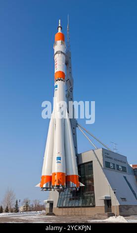 SAMARA, RUSSIA - MARCH 10: Real Soyuz type rocket as monument on March 10, 2012 in Samara. Rocket height together with building Stock Photo