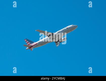 An American Airlines Airbus A320 gains altitude shortly after takeoff. Stock Photo