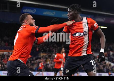 Luton Town's Elijah Adebayo (right) celebrates with Carlton Morris after scoring their side's first goal of the game during the Sky Bet Championship match at Kenilworth Road, Luton. Picture date: Wednesday October 23, 2024. Stock Photo