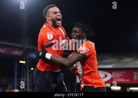 Luton Town's Elijah Adebayo (right) celebrates with Carlton Morris after scoring their side's first goal of the game during the Sky Bet Championship match at Kenilworth Road, Luton. Picture date: Wednesday October 23, 2024. Stock Photo