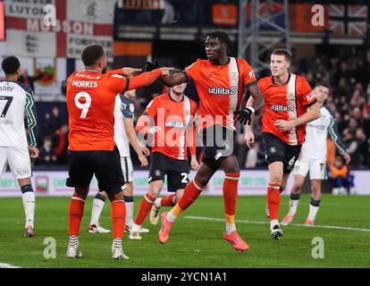 Luton Town's Elijah Adebayo (right) celebrates scoring their side's first goal of the game during the Sky Bet Championship match at Kenilworth Road, Luton. Picture date: Wednesday October 23, 2024. Stock Photo