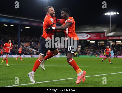 Luton Town's Elijah Adebayo (right) celebrates with Carlton Morris after scoring their side's first goal of the game during the Sky Bet Championship match at Kenilworth Road, Luton. Picture date: Wednesday October 23, 2024. Stock Photo