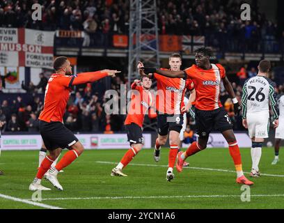 Luton Town's Elijah Adebayo (right) celebrates scoring their side's first goal of the game during the Sky Bet Championship match at Kenilworth Road, Luton. Picture date: Wednesday October 23, 2024. Stock Photo