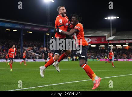 Luton Town's Elijah Adebayo (right) celebrates with Carlton Morris after scoring their side's first goal of the game during the Sky Bet Championship match at Kenilworth Road, Luton. Picture date: Wednesday October 23, 2024. Stock Photo