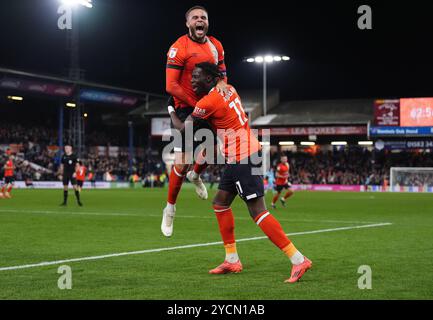 Luton Town's Elijah Adebayo (right) celebrates with Carlton Morris after scoring their side's first goal of the game during the Sky Bet Championship match at Kenilworth Road, Luton. Picture date: Wednesday October 23, 2024. Stock Photo