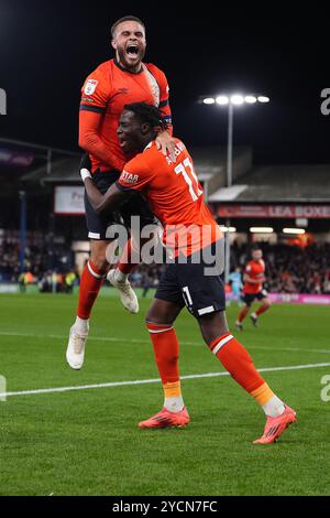 Luton Town's Elijah Adebayo (right) celebrates with Carlton Morris after scoring their side's first goal of the game during the Sky Bet Championship match at Kenilworth Road, Luton. Picture date: Wednesday October 23, 2024. Stock Photo