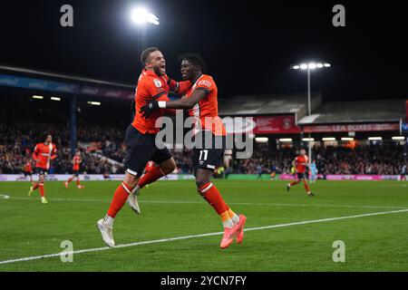 Luton Town's Elijah Adebayo (right) celebrates with Carlton Morris after scoring their side's first goal of the game during the Sky Bet Championship match at Kenilworth Road, Luton. Picture date: Wednesday October 23, 2024. Stock Photo