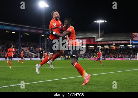 Luton Town's Elijah Adebayo (right) celebrates with Carlton Morris after scoring their side's first goal of the game during the Sky Bet Championship match at Kenilworth Road, Luton. Picture date: Wednesday October 23, 2024. Stock Photo