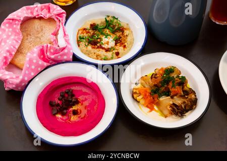 Different types of meze dishes served on table Stock Photo